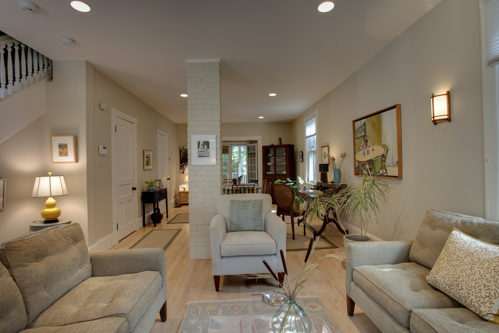 Example of a trendy living room design in DC Metro with beige walls