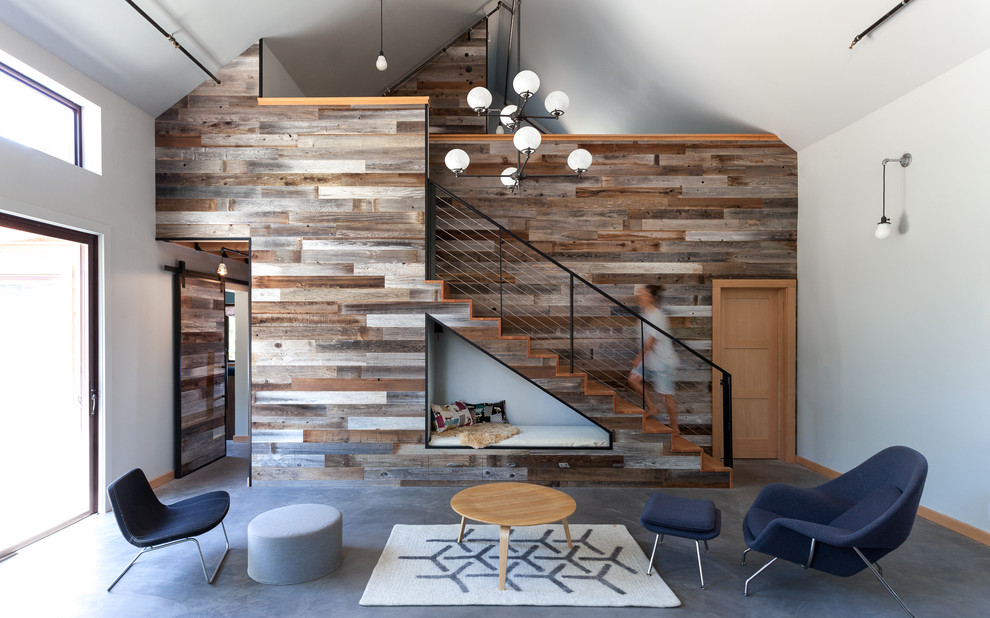 Living room - rustic concrete floor living room idea in Sacramento with white walls