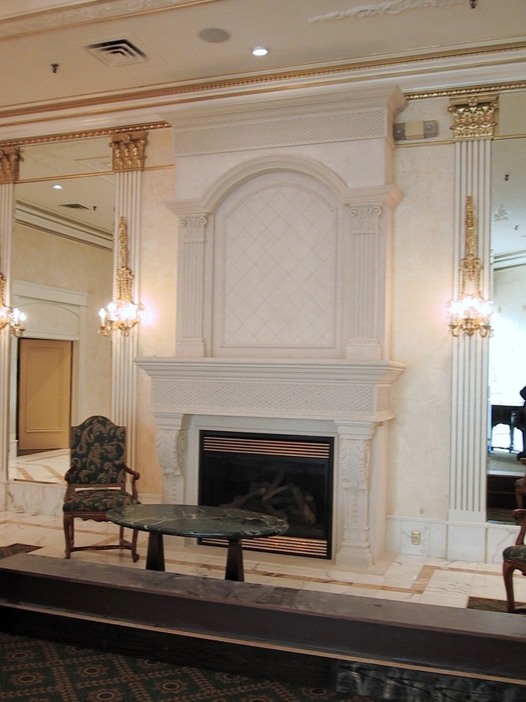 Example of a large classic formal and enclosed medium tone wood floor living room design with brown walls, a standard fireplace, a stone fireplace and a wall-mounted tv