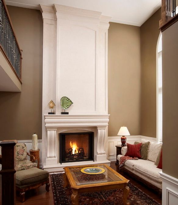 Photo of a large traditional formal enclosed living room in Other with medium hardwood flooring, a standard fireplace, a stone fireplace surround, brown walls and a wall mounted tv.