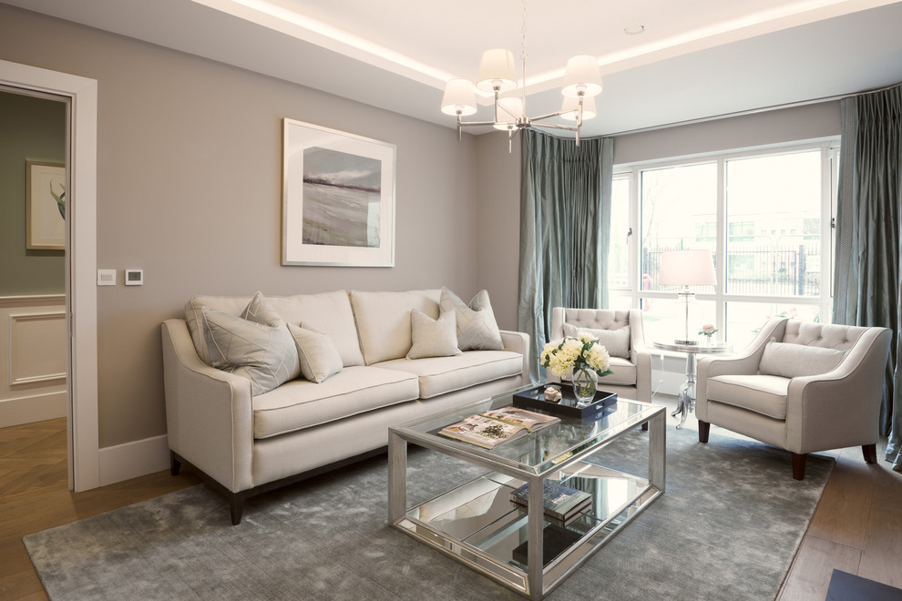 This is an example of a traditional formal enclosed living room in Dublin with grey walls.
