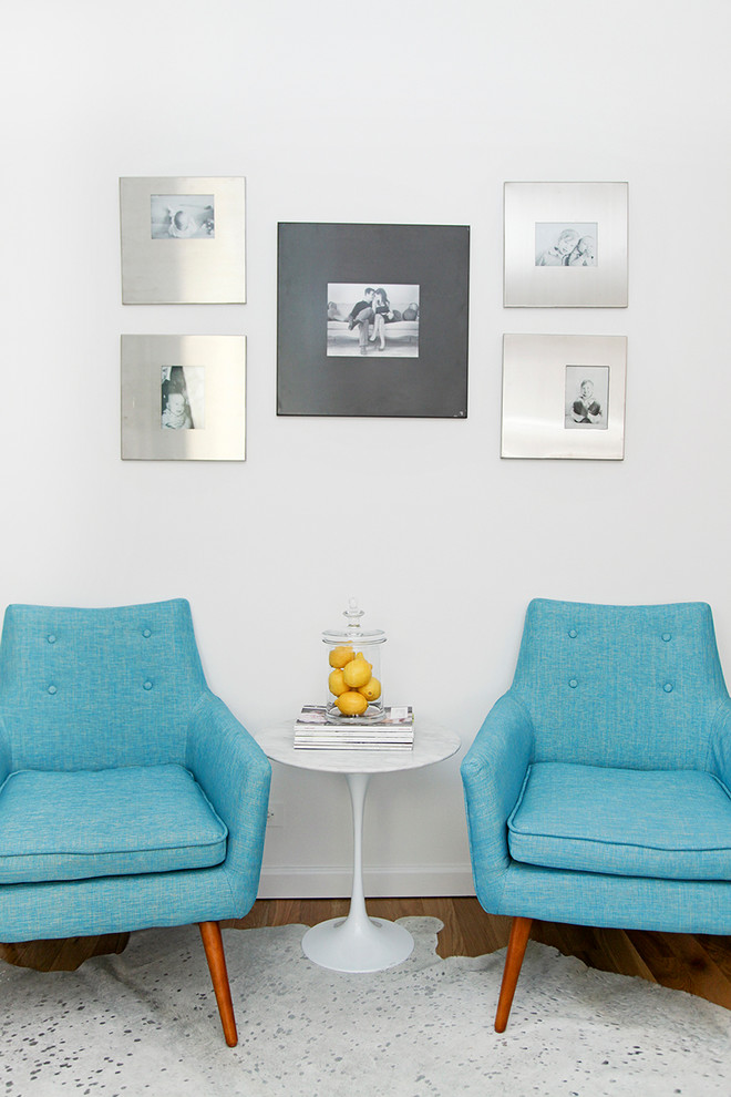Trendy living room photo in New York with white walls