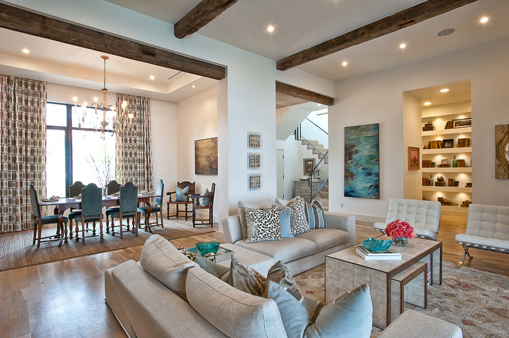 Example of a classic open concept living room design in Austin with beige walls