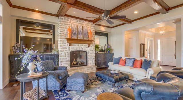 Inspiration for a large traditional formal enclosed living room in Boise with white walls, medium hardwood flooring, a standard fireplace, a stone fireplace surround, no tv and brown floors.