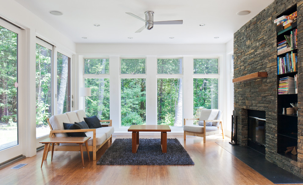 This is an example of a modern living room in Boston with white walls.