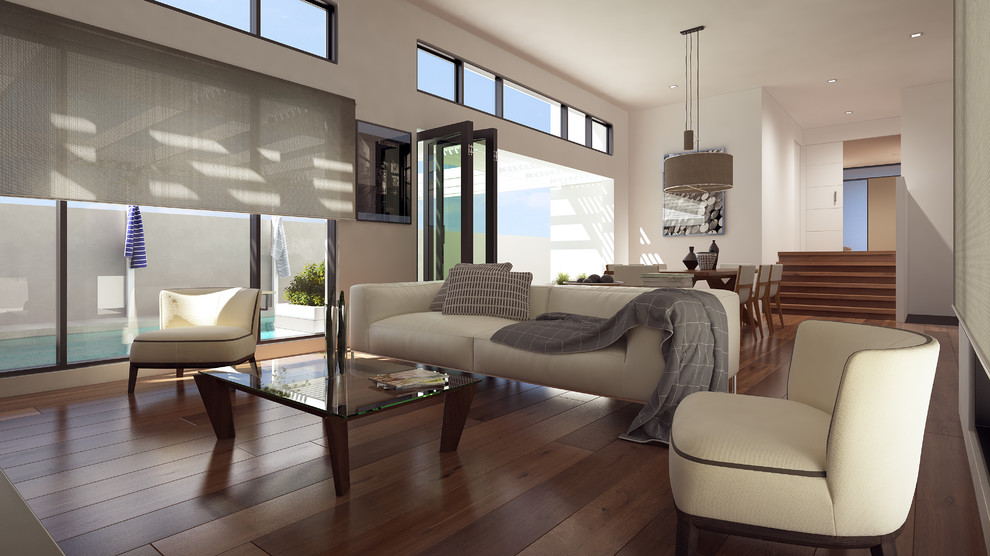 Foto di un grande soggiorno design aperto con pareti bianche, pavimento in legno massello medio e TV a parete