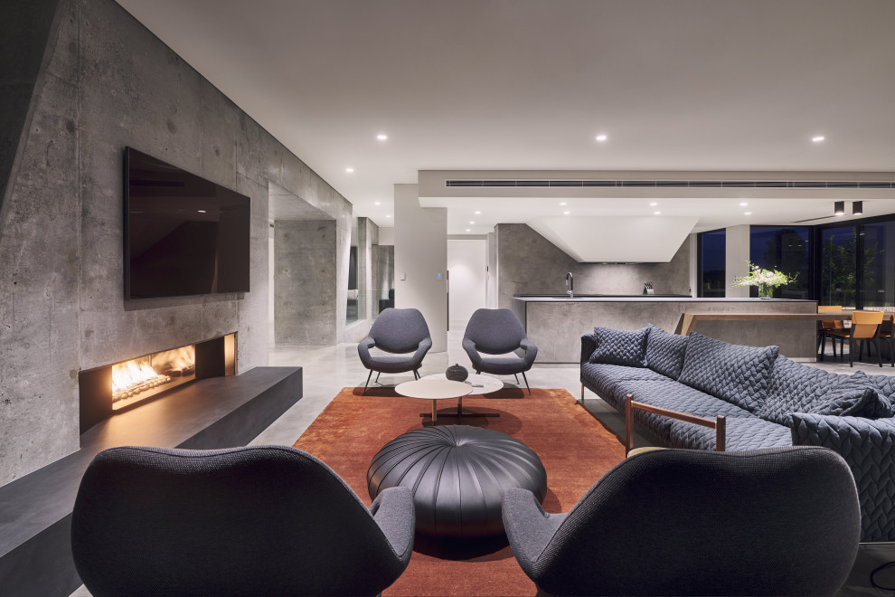 Design ideas for a large modern open plan living room in Perth with grey walls, concrete flooring, a concrete fireplace surround, a wall mounted tv, grey floors and a ribbon fireplace.