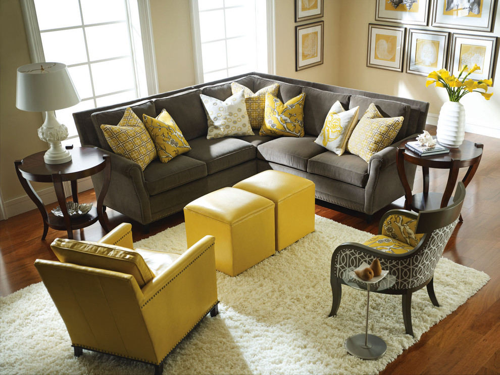 Photo of a medium sized classic formal open plan living room in Charlotte with yellow walls, dark hardwood flooring, no fireplace, no tv and brown floors.