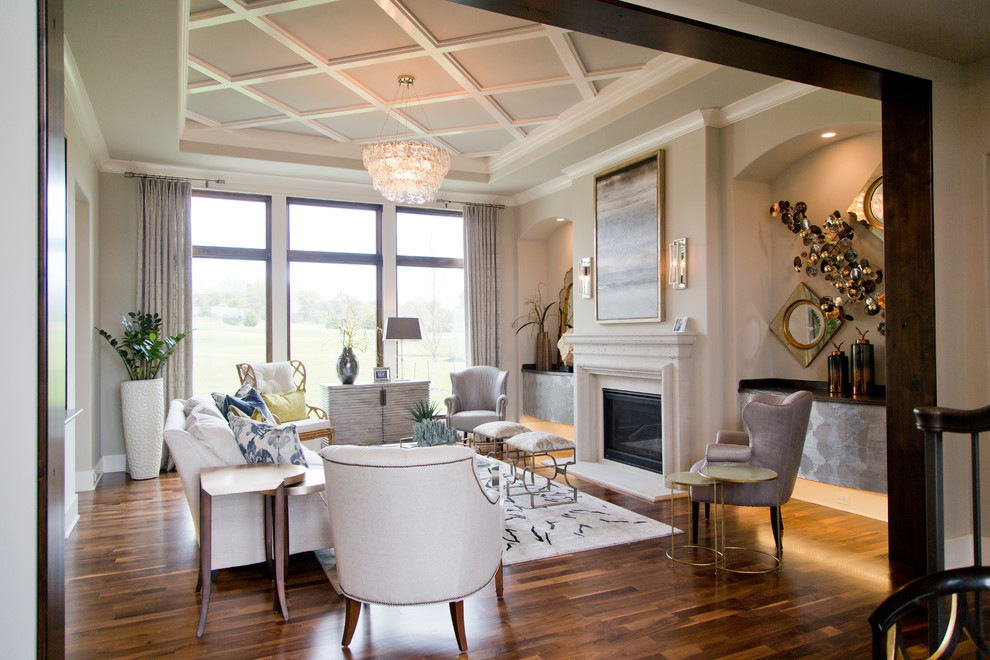 Diseño de salón para visitas abierto minimalista grande con paredes beige, suelo de madera en tonos medios y todas las chimeneas