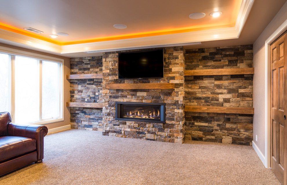 Design ideas for a large rustic formal open plan living room in Kansas City with a stone fireplace surround, grey walls, carpet, a ribbon fireplace and a wall mounted tv.