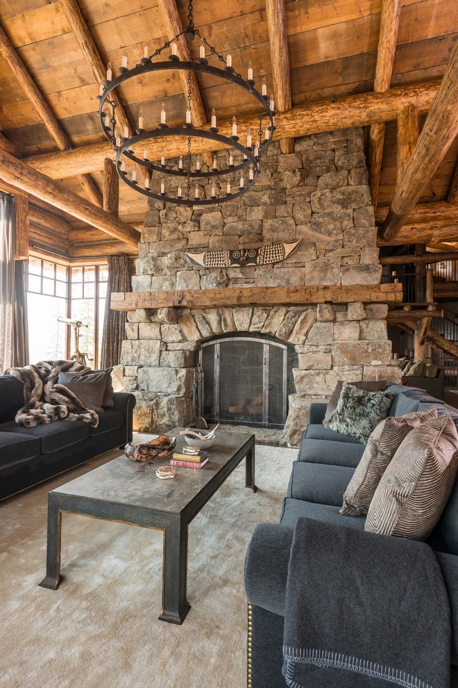 Inspiration for a rustic formal living room remodel in Other with a standard fireplace, a stone fireplace and no tv