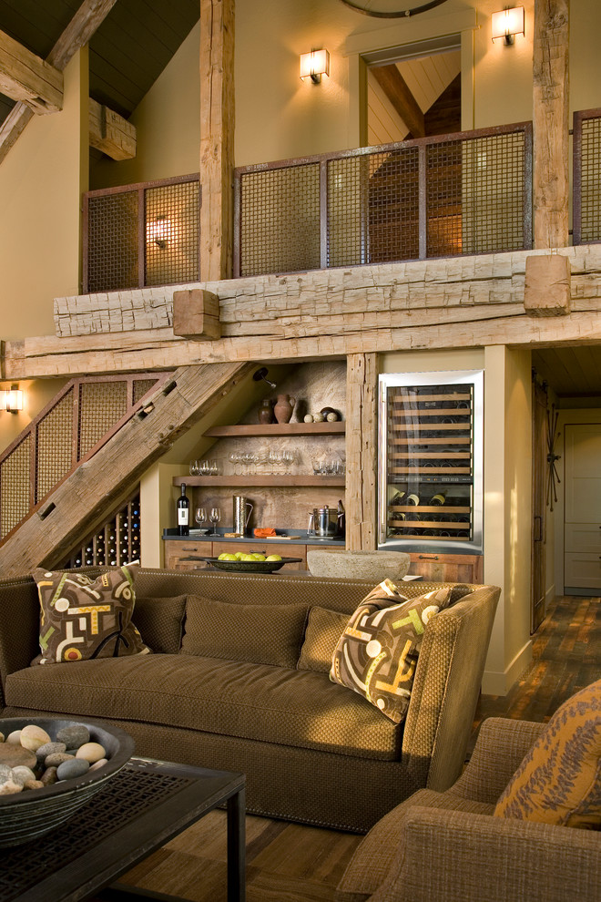 Inspiration for a medium sized rustic open plan living room in Other with beige walls and a home bar.