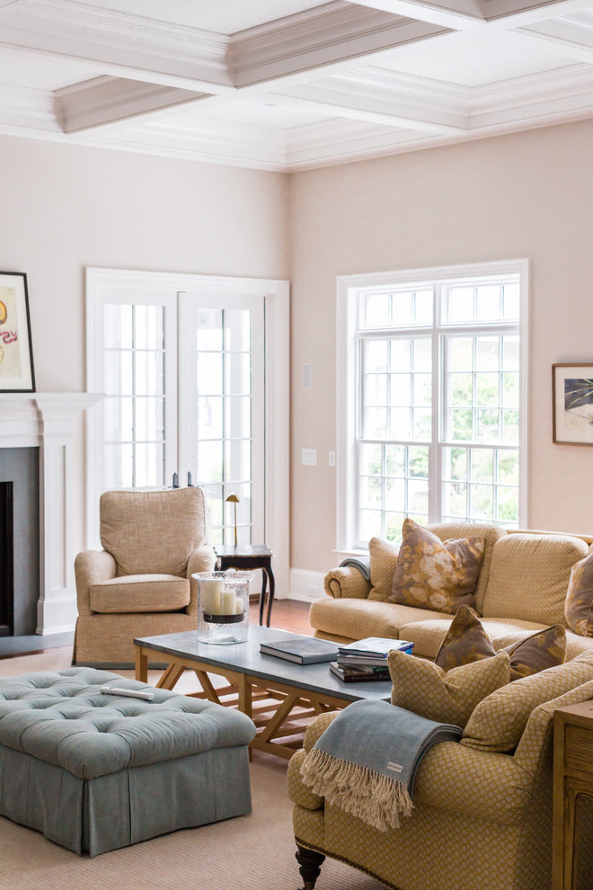 Elegant living room photo in Raleigh with beige walls