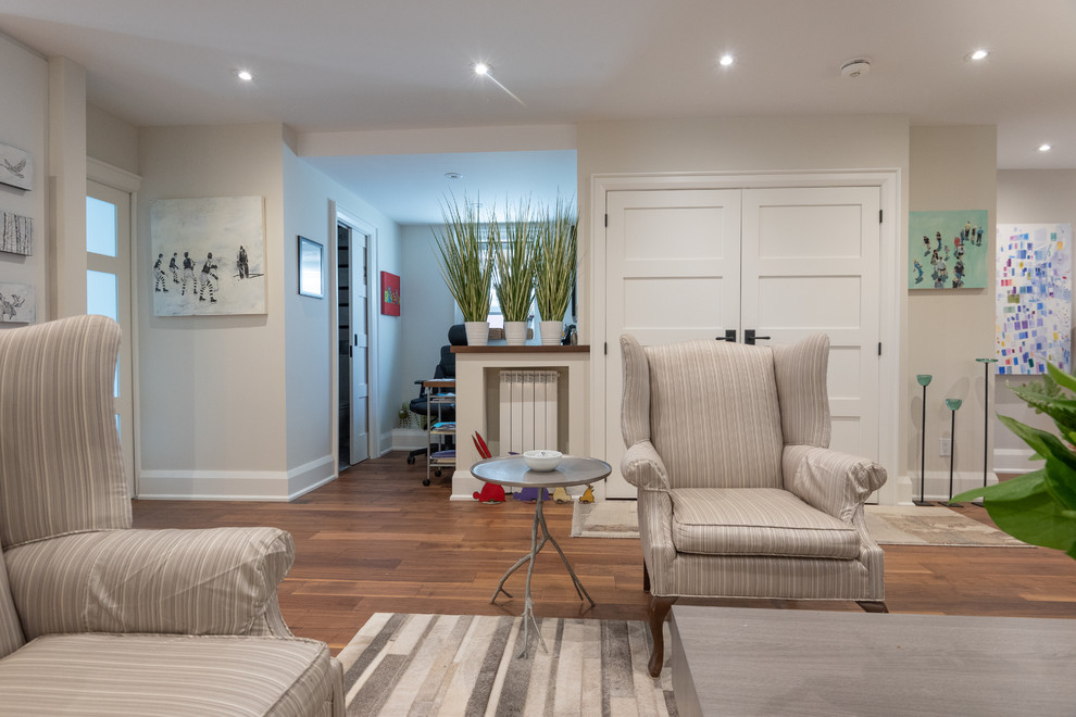 Medium sized classic formal open plan living room in Toronto with grey walls, dark hardwood flooring, a standard fireplace, a tiled fireplace surround, no tv and brown floors.