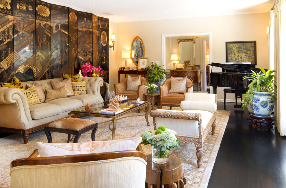 This is an example of a classic living room in Los Angeles with a music area, beige walls and dark hardwood flooring.