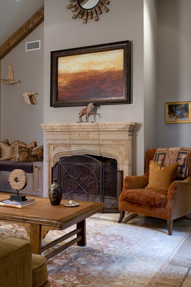 Example of a classic open concept living room design in Los Angeles with a standard fireplace and a stone fireplace