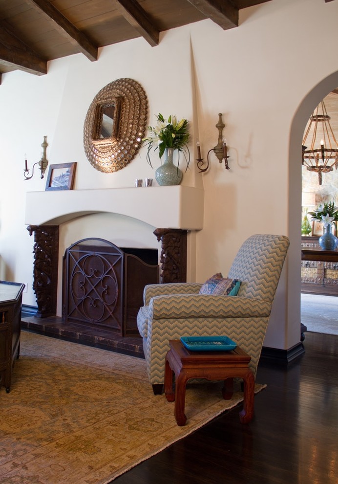 Living room - mediterranean dark wood floor living room idea in Los Angeles with a standard fireplace
