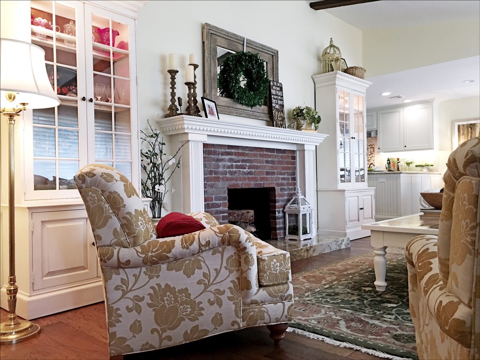 Example of a large country open concept medium tone wood floor living room design in Los Angeles with a standard fireplace and a brick fireplace