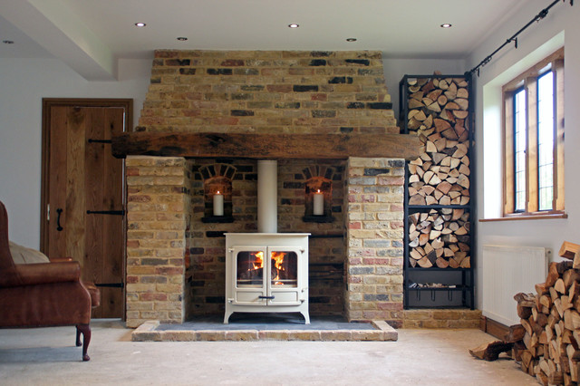 Charnwood island 3b wood boiler stove with reclaimed brick and oak fireplace  - Traditional - Living Room - Essex - by Scarlett Fireplaces | Houzz NZ