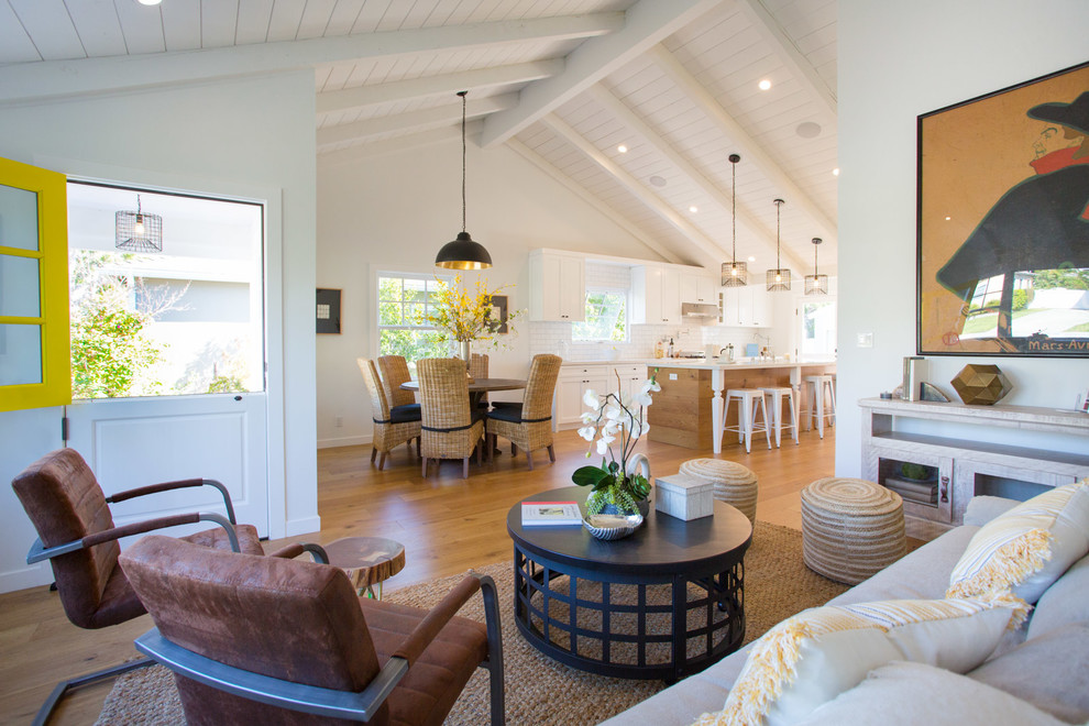 Mid-sized country open concept medium tone wood floor living room photo in Los Angeles with white walls