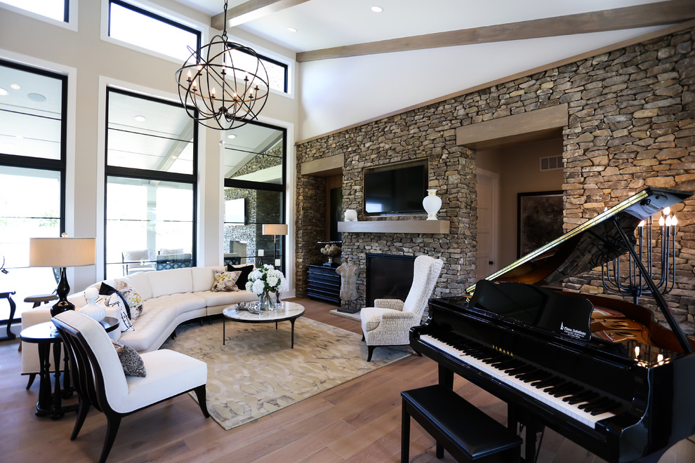 Inspiration for a large cottage light wood floor living room remodel in Indianapolis with beige walls and a wall-mounted tv