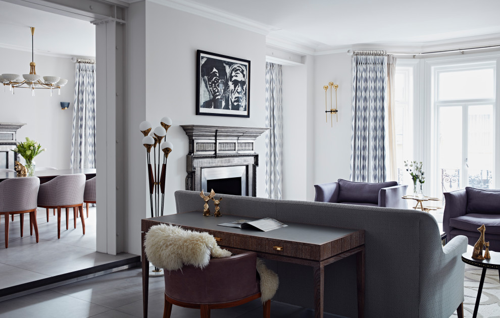Inspiration for a traditional open plan living room in London with grey walls and grey floors.