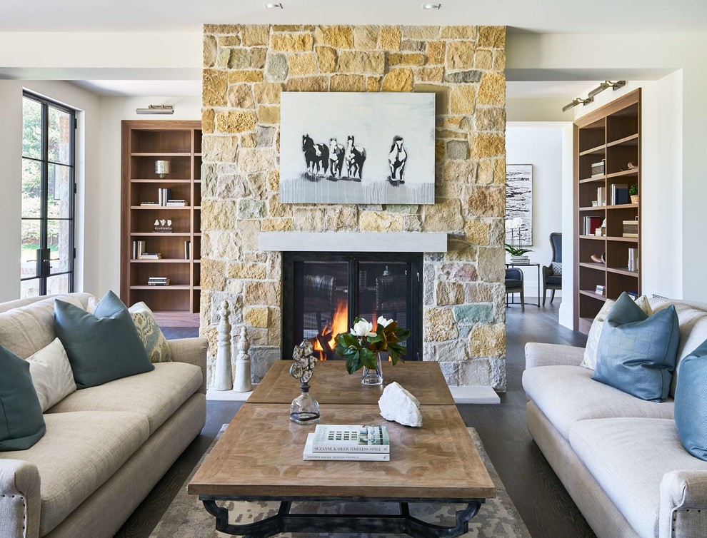 Inspiration for a large traditional open plan living room in Denver with white walls, dark hardwood flooring, a standard fireplace, a stone fireplace surround, no tv and a reading nook.
