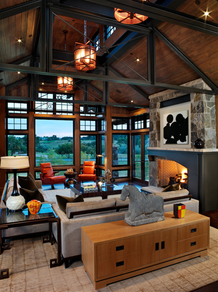 Living room - large contemporary open concept dark wood floor living room idea in Denver with a standard fireplace, a stone fireplace, brown walls and no tv