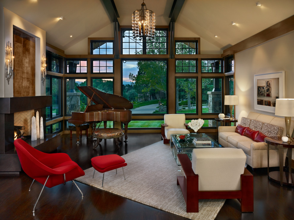 Mid-sized trendy open concept dark wood floor living room photo in Denver with a music area, beige walls, a standard fireplace, a plaster fireplace and no tv