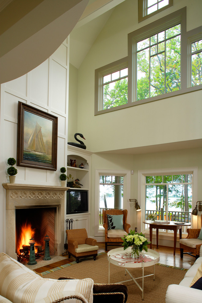 Inspiration for a huge coastal formal and open concept medium tone wood floor living room remodel in Philadelphia with yellow walls, a standard fireplace, a stone fireplace and no tv