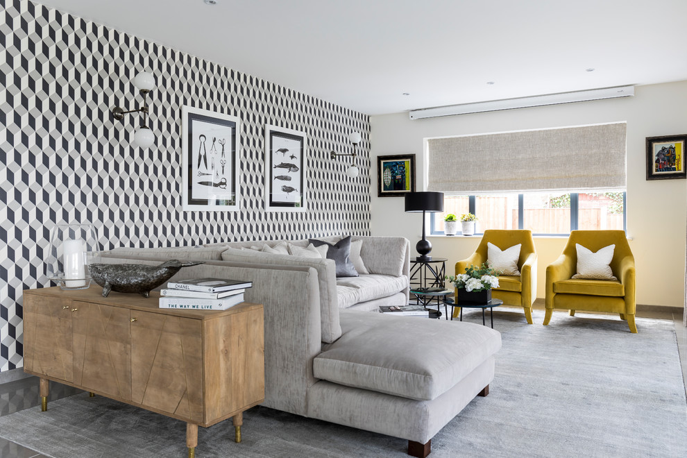 This is an example of a large classic formal open plan living room feature wall in Cheshire with carpet, grey floors and multi-coloured walls.