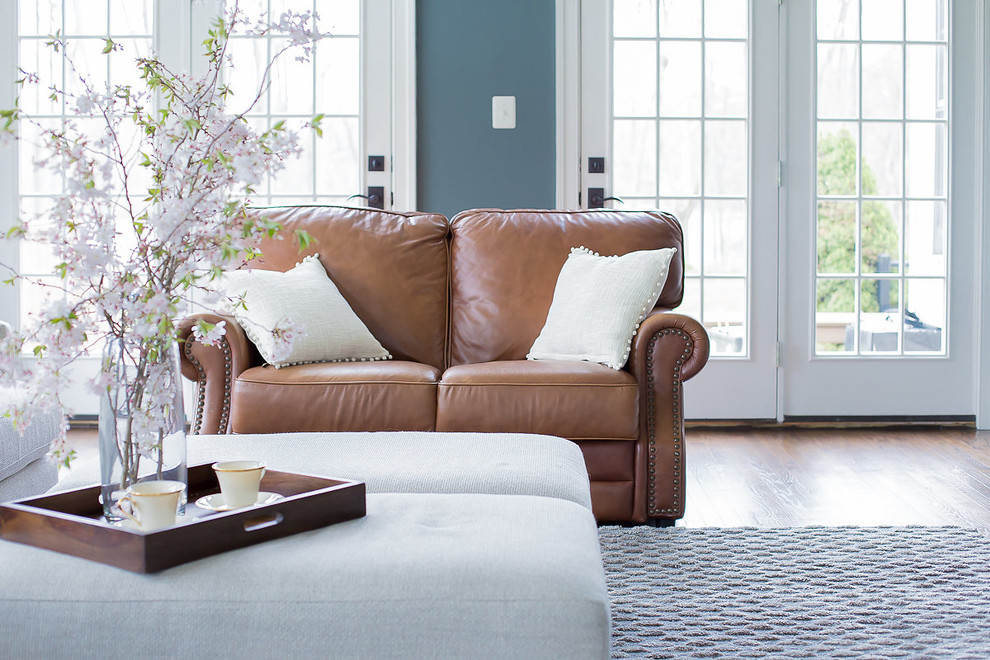 Medium sized classic formal enclosed living room in Philadelphia with grey walls, dark hardwood flooring, no fireplace, no tv and brown floors.