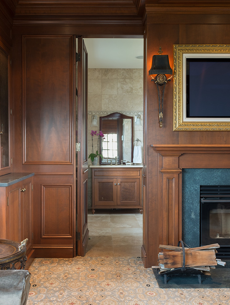 Foto de salón clásico con paredes marrones, todas las chimeneas, marco de chimenea de piedra y televisor colgado en la pared