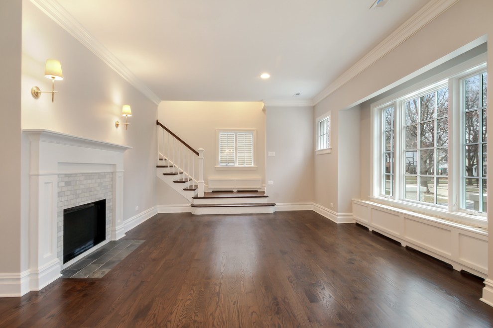 Example of a mid-sized transitional dark wood floor living room design in Chicago with a standard fireplace, a tile fireplace and gray walls