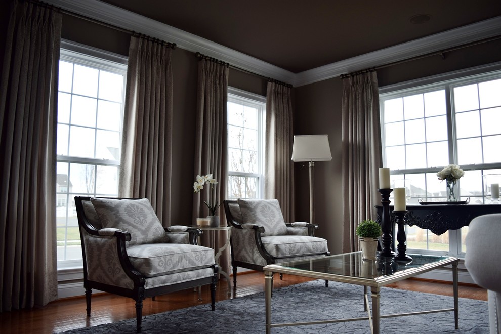 This is an example of a large traditional formal enclosed living room in DC Metro with grey walls and medium hardwood flooring.