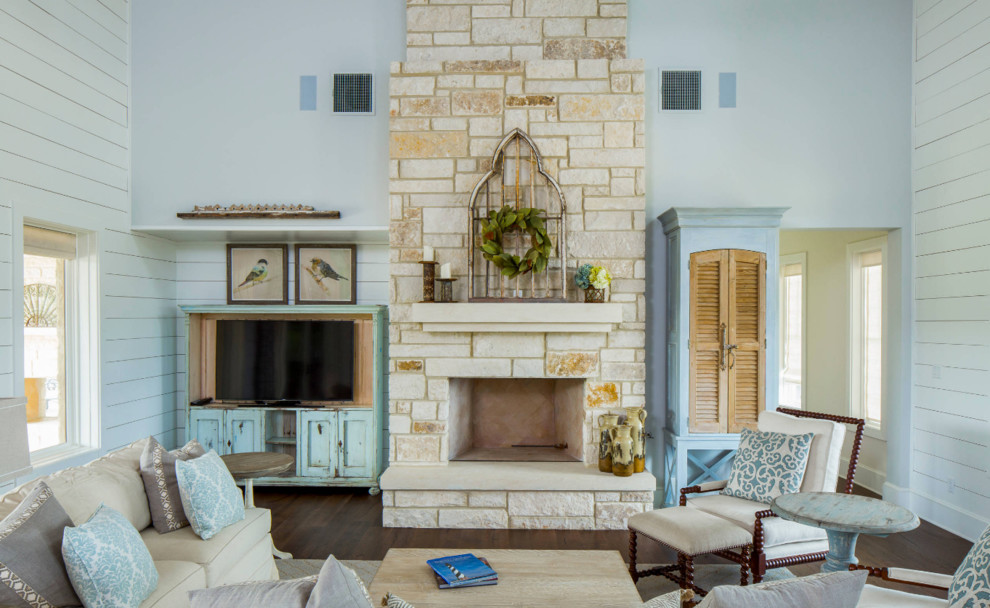 Inspiration for a large rustic formal open plan living room in Austin with white walls, dark hardwood flooring, a standard fireplace, a stone fireplace surround and a built-in media unit.