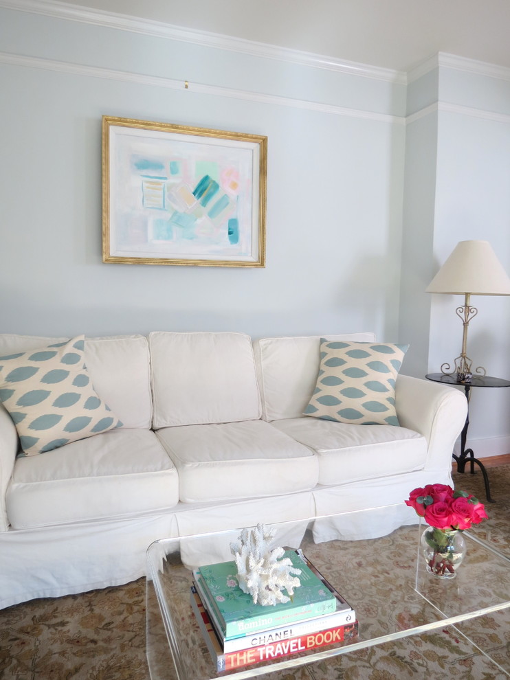Trendy living room photo in Charleston with blue walls