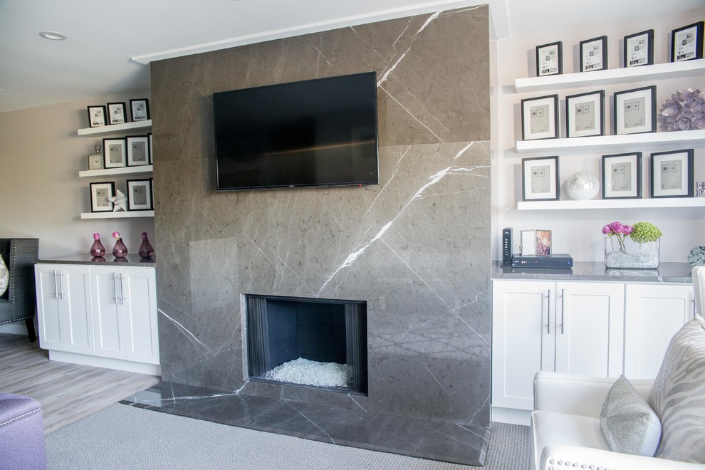 Inspiration for a contemporary living room remodel in Chicago with a stone fireplace