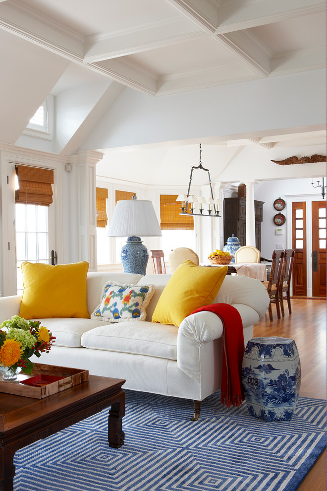 Inspiration for a timeless brown floor living room remodel in Miami with white walls