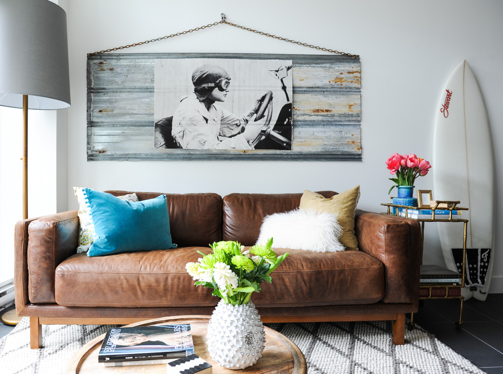 Example of a small eclectic living room design in Vancouver with white walls