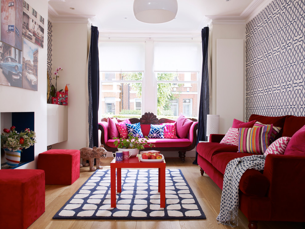 This is an example of a medium sized contemporary formal enclosed living room in London with multi-coloured walls and medium hardwood flooring.