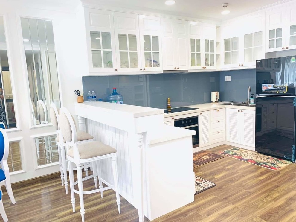 Photo of a medium sized world-inspired kitchen in Other with bamboo flooring and white floors.