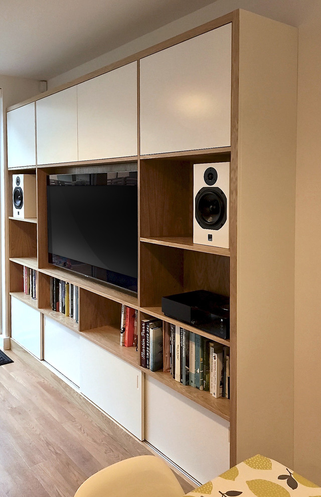 Photo of a large contemporary living room in London with light hardwood flooring and a built-in media unit.