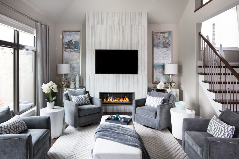 Example of a mid-sized trendy enclosed dark wood floor and white floor living room design in Other with gray walls, a ribbon fireplace, a wall-mounted tv and a tile fireplace
