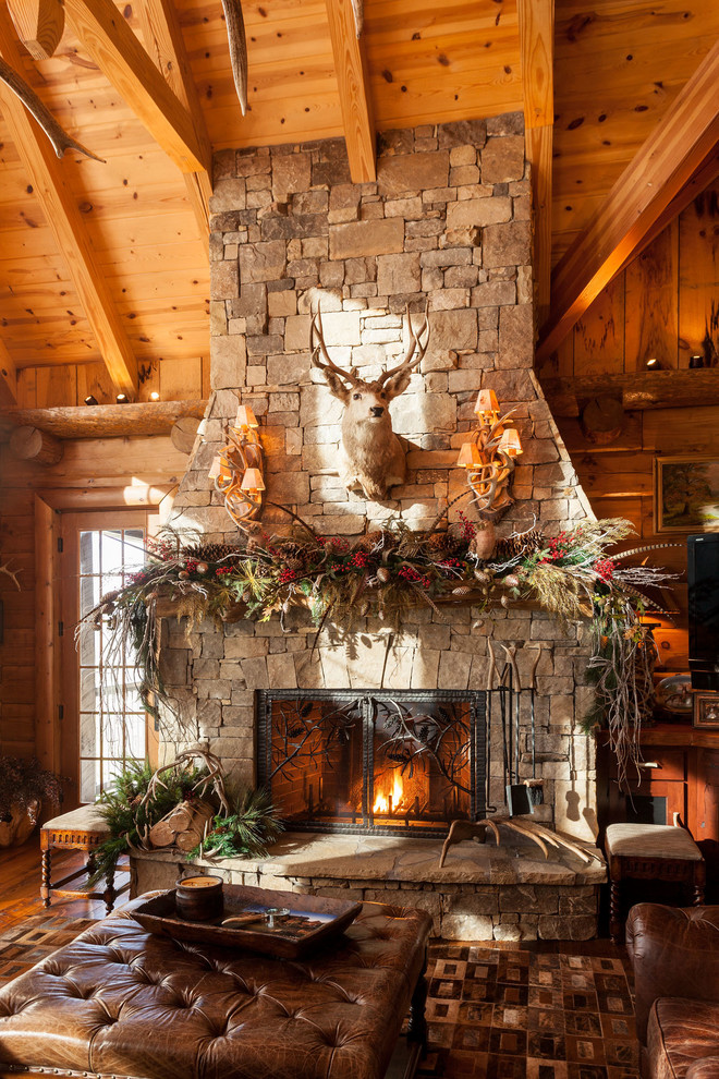Inspiration for a rustic formal and open concept brown floor living room remodel in Atlanta with brown walls, a standard fireplace, a stone fireplace and no tv