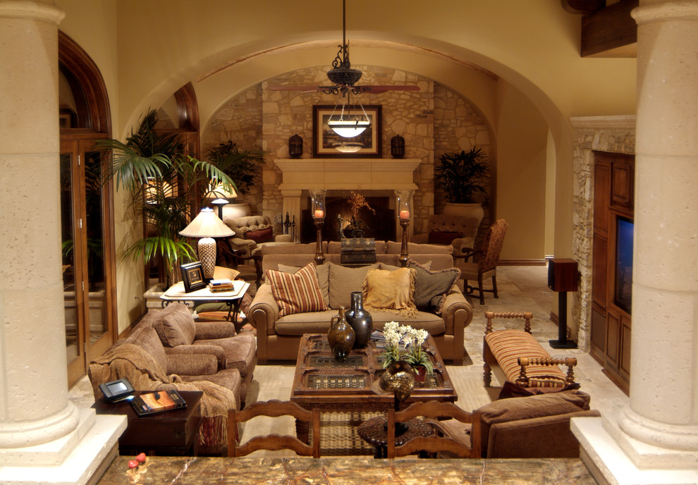 Photo of a mediterranean formal living room in Houston with a standard fireplace and a built-in media unit.