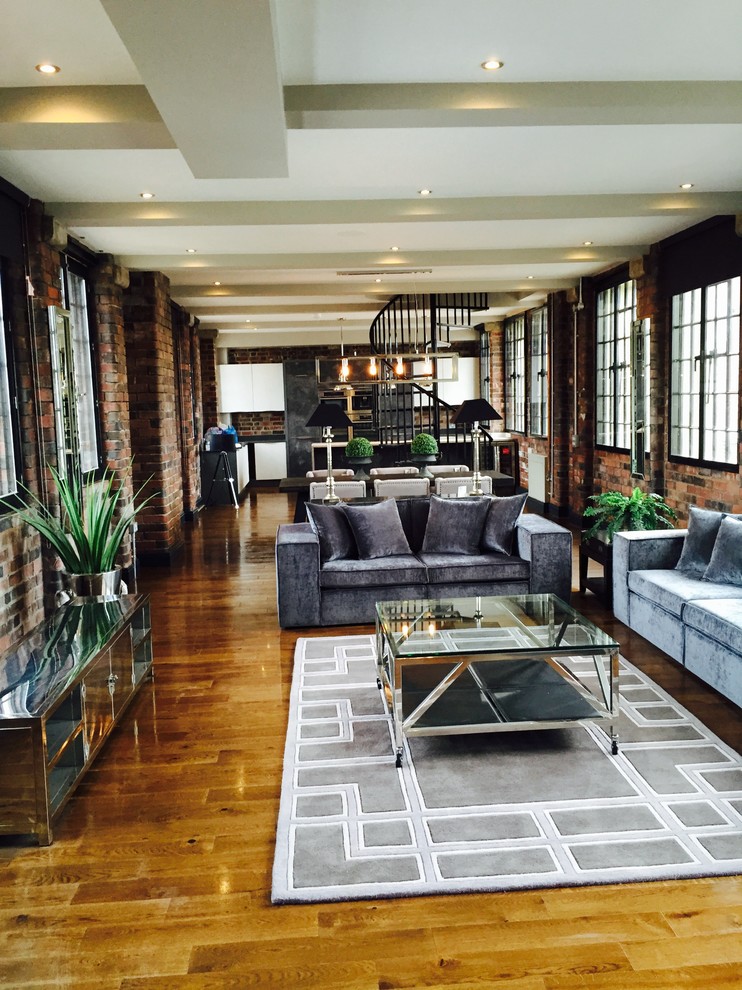 Inspiration for a medium sized industrial open plan living room in West Midlands with dark hardwood flooring and a freestanding tv.