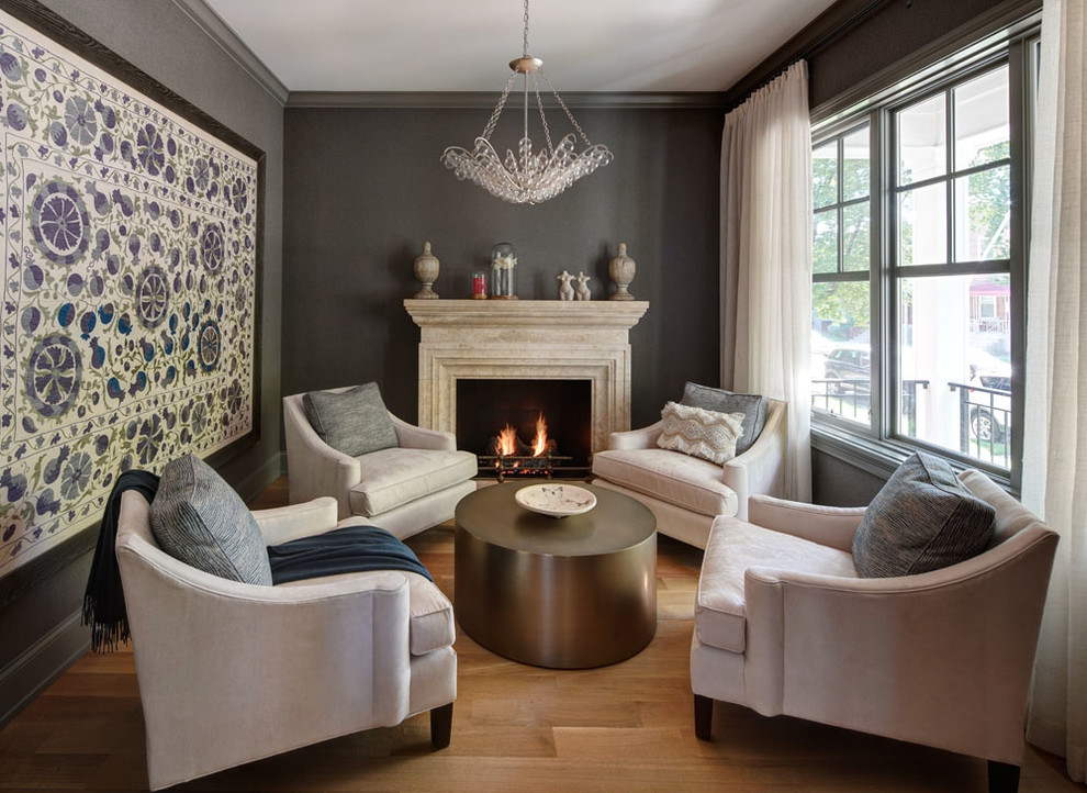 Example of a large transitional enclosed and formal medium tone wood floor and brown floor living room design in Chicago with gray walls, a standard fireplace, a stone fireplace and no tv