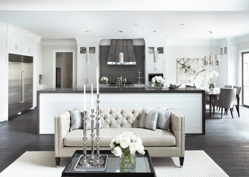 Example of a large transitional open concept dark wood floor living room design in Charleston with white walls