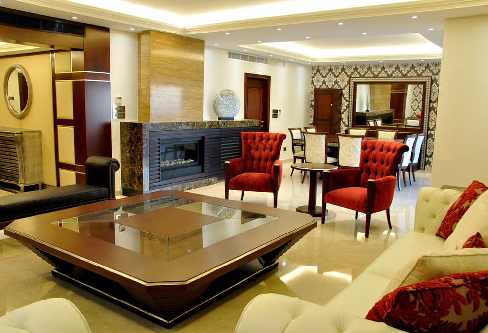 Exemple d'un grand salon tendance ouvert avec une salle de réception, un mur beige, un sol en marbre, un manteau de cheminée en pierre, un téléviseur dissimulé et une cheminée ribbon.
